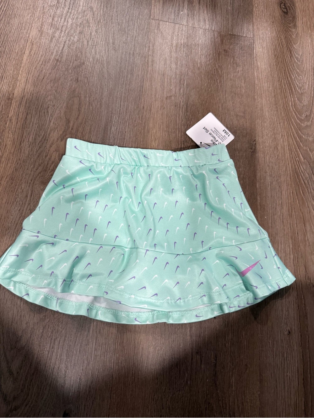 Nike Mint Green Athletic Skort with Purple Swoosh Accents